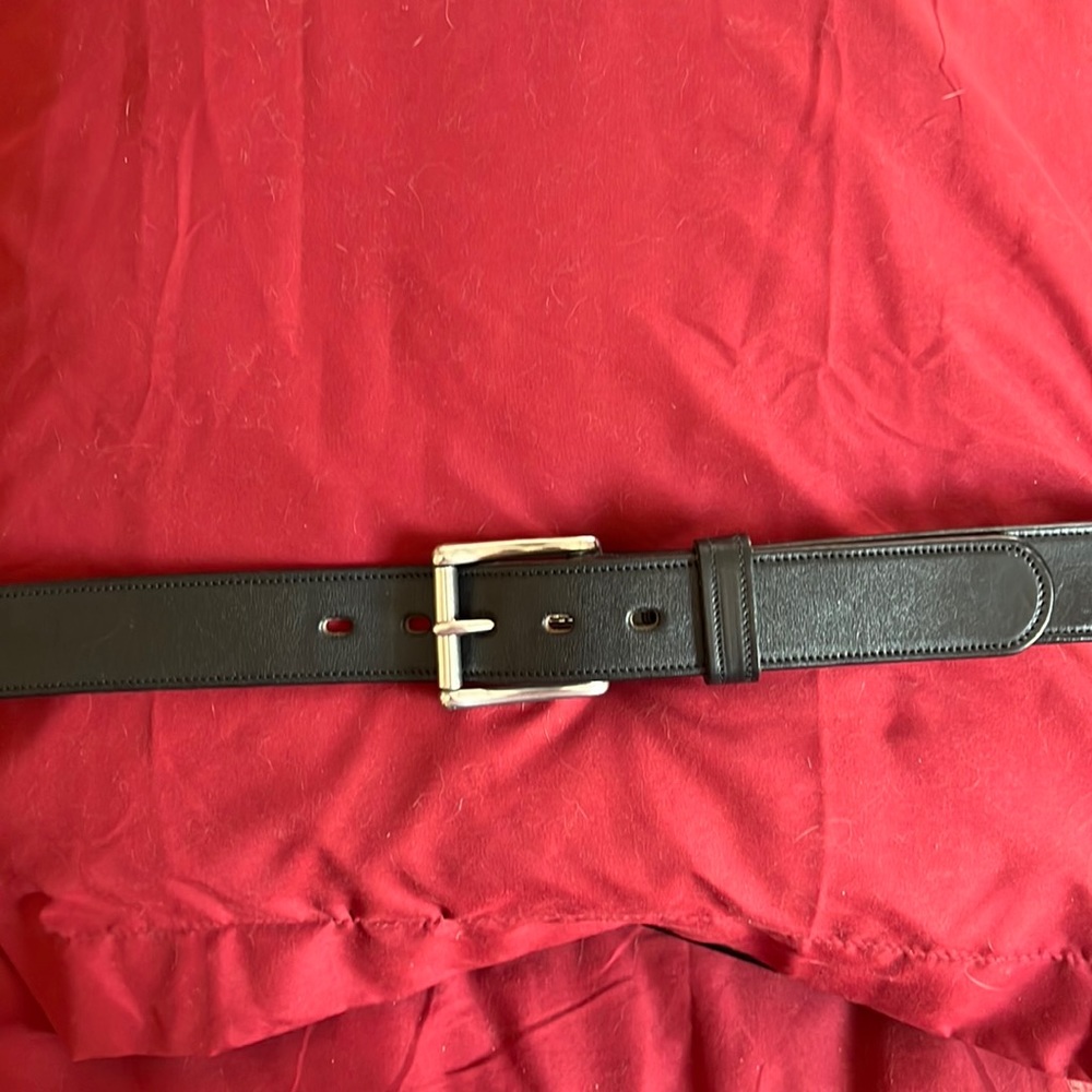 Men’s black leather belt 50” x 1.5”.  Excellent condition; Silvertone hardware